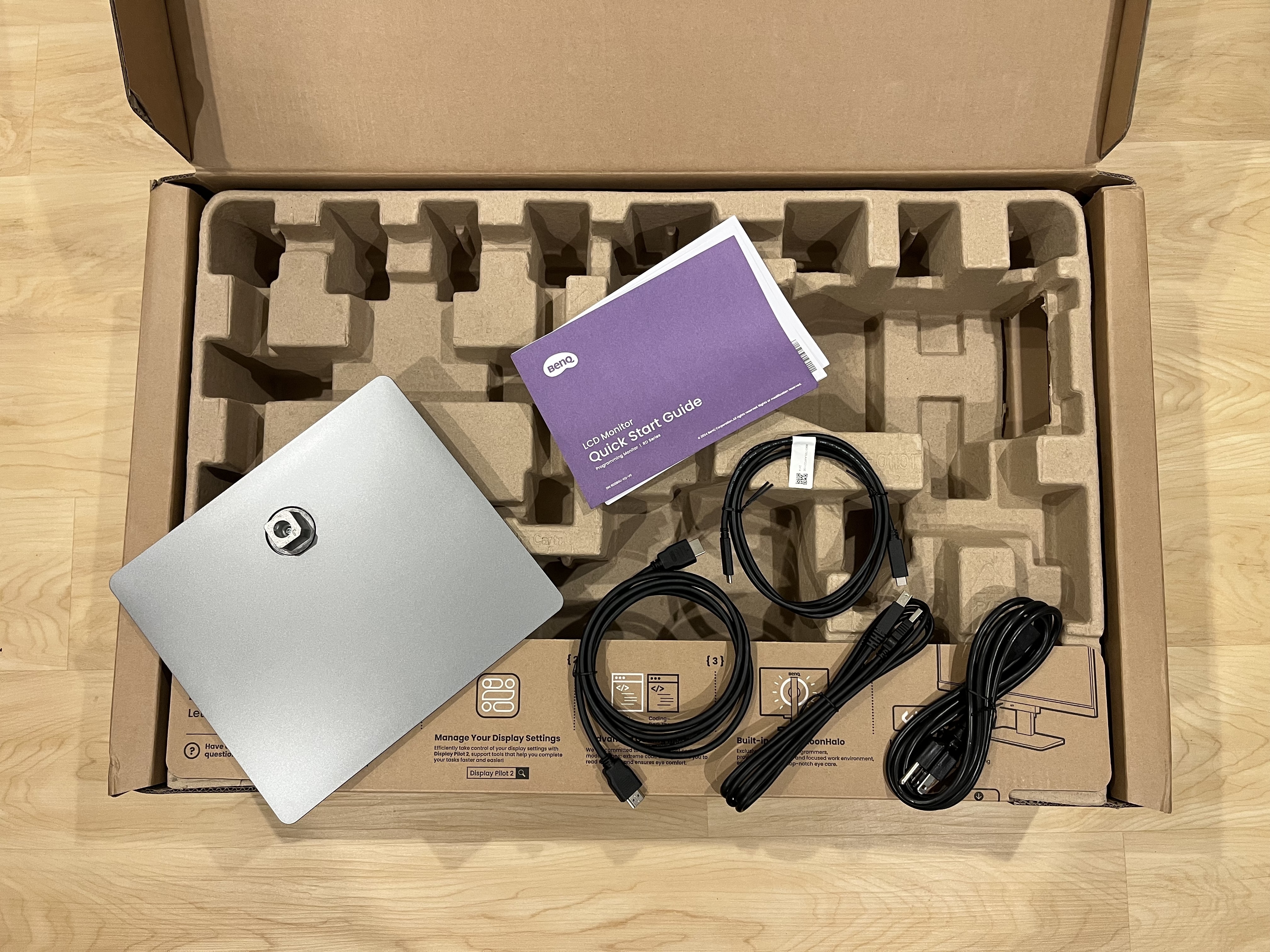 BenQ RD280U box open with some of the pieces sitting on the open box